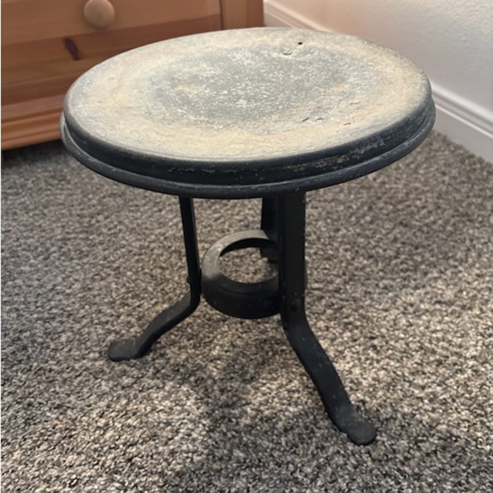 Authentic, antique cast iron milk stool. Very heavy. 11” high X 10” across